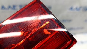 The inner light of the right trunk door of Volvo XC60 20-26 is worn, scratches