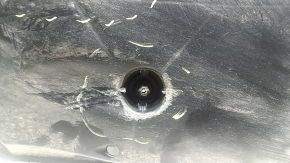 The left underbody protection of the Audi A3 22-26 is dented and worn