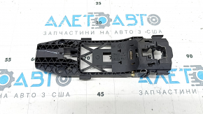 The rear left door handle mechanism of a VW Taos 22-25 has a broken mount