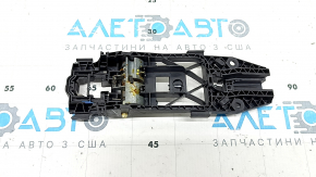 The rear left door handle mechanism of a VW Taos 22-25 has a broken mount