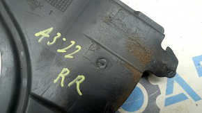 The rear right underbody protection of the Audi A3 22-26 is worn and torn