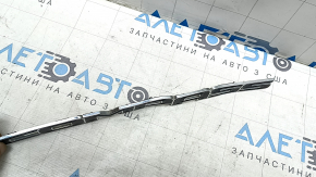 The emblem with the COMPASS inscription on the front right door of the Jeep Compass 17-26 is bent and scratched
