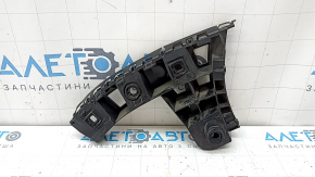 The rear bumper mount, outer left, VW Taos 22-25, is broken