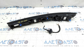 The inner tailgate light, left, Nissan Murano 25-26, is glued