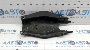 The rear left control arm cover under the spring of a Mercedes C-class W205 16-21 has broken fastenings, scratches, and a tear
