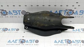 The rear left control arm cover under the spring of a Mercedes C-class W205 16-21 has broken fastenings, scratches, and a tear