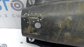 The rear left control arm cover under the spring of a Mercedes C-class W205 16-21 has broken fastenings, scratches, and a tear