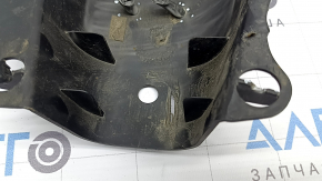 The rear left control arm cover under the spring of a Mercedes C-class W205 16-21 has broken fastenings, scratches, and a tear