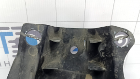 The rear right control arm cover under the spring of a Mercedes C-class W205 16-21 has broken fasteners, scratches, and a tear