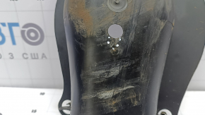 The rear right control arm cover under the spring of a Mercedes C-class W205 16-21 has broken fasteners, scratches, and a tear