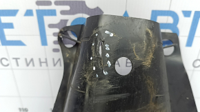 The rear right control arm cover under the spring of a Mercedes C-class W205 16-21 has broken fasteners, scratches, and a tear
