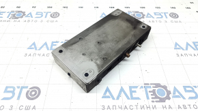 The control unit for the lane keeping camera for Nissan Murano 25-26 has a melted connector, is covered in soot, and the connector is missing