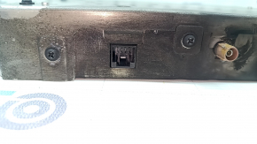 The control unit for the lane keeping camera for Nissan Murano 25-26 has a melted connector, is covered in soot, and the connector is missing