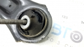 The lower front left control arm of a VW Taos 22-24 has a torn silent block