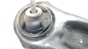 The lower front right control arm of a VW Taos 22-25 has a torn silent block