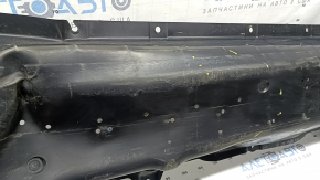 The front right underbody protection of Nissan Murano 25-26 is dented