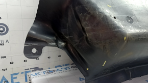 The front left underbody protection of Nissan Murano 25-26 is dented