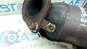 The exhaust manifold with a catalytic converter for a Nissan Kicks 20-25 is rusty and the studs are sawed off