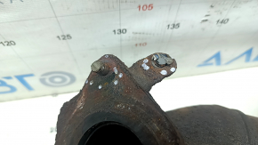 The exhaust manifold with a catalytic converter for a Nissan Kicks 20-25 is rusty and the studs are sawed off