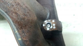 The exhaust manifold with a catalytic converter for a Nissan Kicks 20-25 is rusty and the studs are sawed off