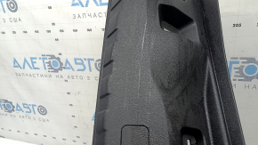 The trunk opening trim for BMW 3 G20 19-26 is black, scratches, and the fasteners are broken