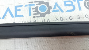 The front right door seal for Nissan Kicks 18-25 is dented