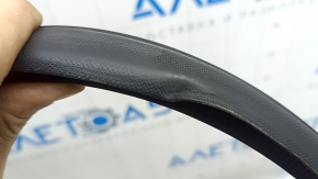 The front left door seal of the Nissan Kicks 18-25 is dented