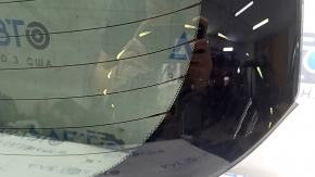 Rear glass of the trunk door of Nissan Murano 25-26 in glue