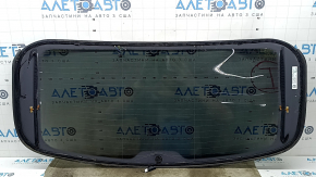 The rear glass of the trunk door of a Porsche Macan 15-16 with a trunk release button is worn, the heating tracks are oxidized