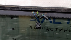 The rear glass of the trunk door of a Porsche Macan 15-16 with a trunk release button is worn, the heating tracks are oxidized