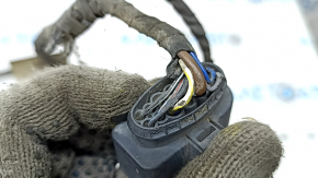 Wiring for the front bumper of a Porsche Macan 15-26 for parking sensors and fog lights, the wires are frayed