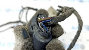 Wiring for the front bumper of a Porsche Macan 15-26 for parking sensors and fog lights, the wires are frayed