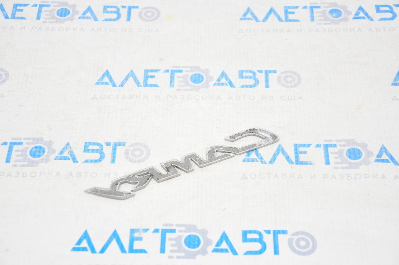 The "CAMRY" emblem on the Toyota Camry v40 trunk lid