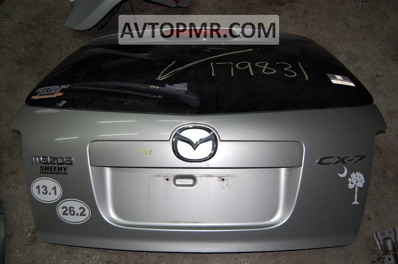 The "CX-7" emblem on the tailgate of the Mazda CX-7 06-12