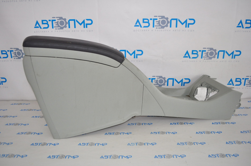 The center console from the armrest to the cup holder of the Toyota Prius 30 10-11 is gray.