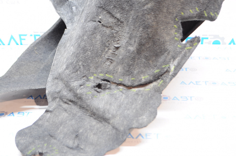 The rear right fender liner of a 14-20 Nissan Rogue is torn.