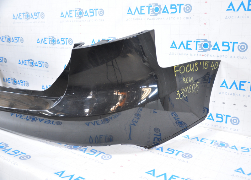 Rear bumper bare Ford Focus mk3 15-18 rest 4d black dented on the left, broken fasteners