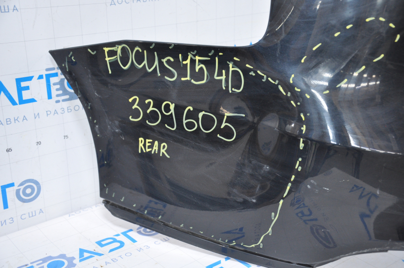 Rear bumper bare Ford Focus mk3 15-18 rest 4d black dented on the left, broken fasteners