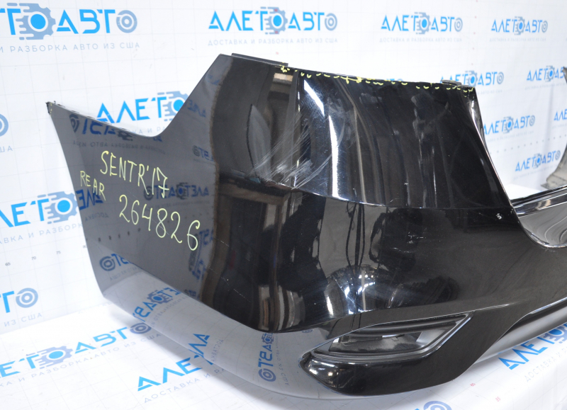 Bare rear bumper Nissan Sentra 16-19 rest black tear at the bottom, torn fasteners, sawed corner, dented