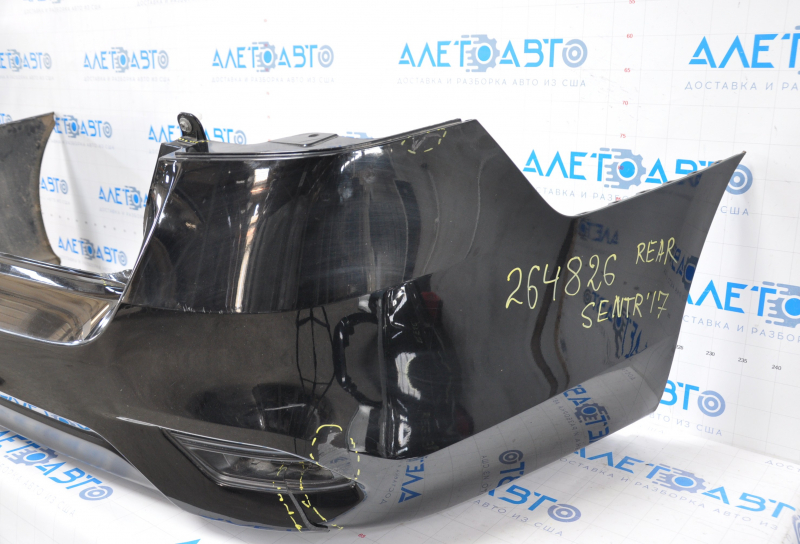 Bare rear bumper Nissan Sentra 16-19 rest black tear at the bottom, torn fasteners, sawed corner, dented