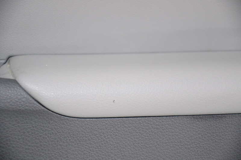 Door trim card rear right VW Jetta 11-18 USA black with gray chrome insert, leather defect