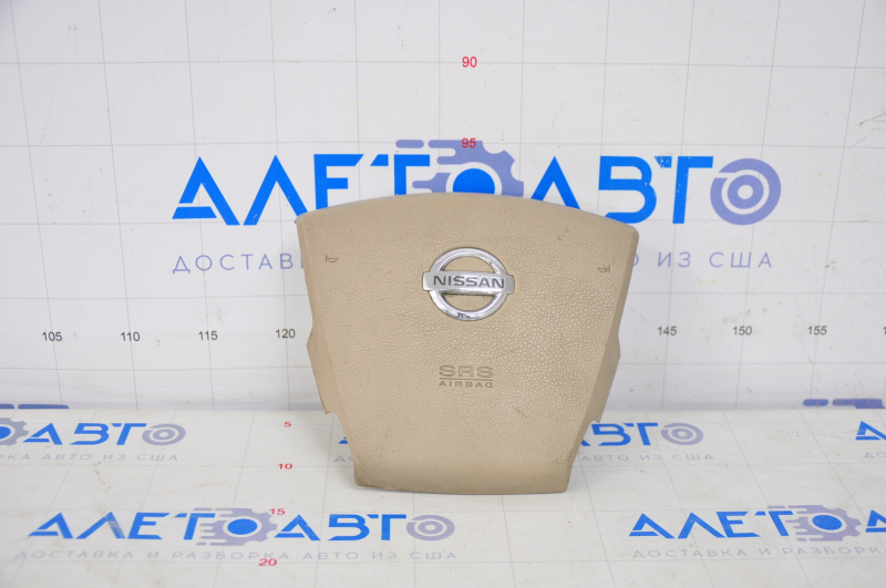 Driver's steering wheel airbag for a 2007-2009 Nissan Versa, beige, scratches