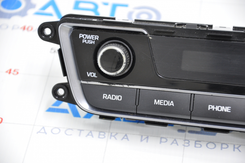 Hyundai Sonata 15-17 clock panel with radio control, crack in overlay, chrome chipped