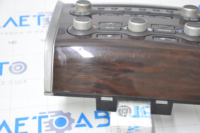 Climate control and audio control Nissan Pathfinder 13-16 under navigation, wood-like scratched and rubbed overlay
