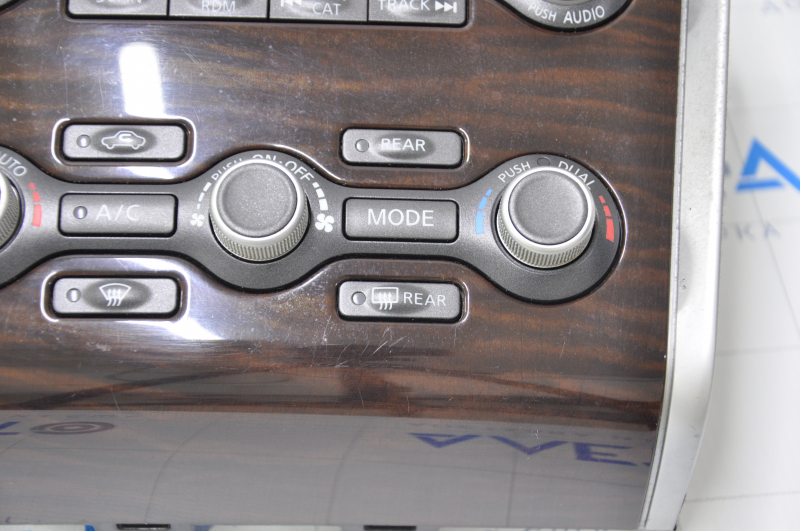 Climate control and audio control Nissan Pathfinder 13-16 under navigation, wood-like scratched and rubbed overlay