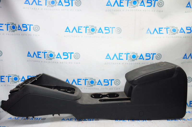 Central console armrest and cup holders VW Jetta 11-18 USA leather black, under armrest, under lock release button, under multimedia unit type 2, scratches