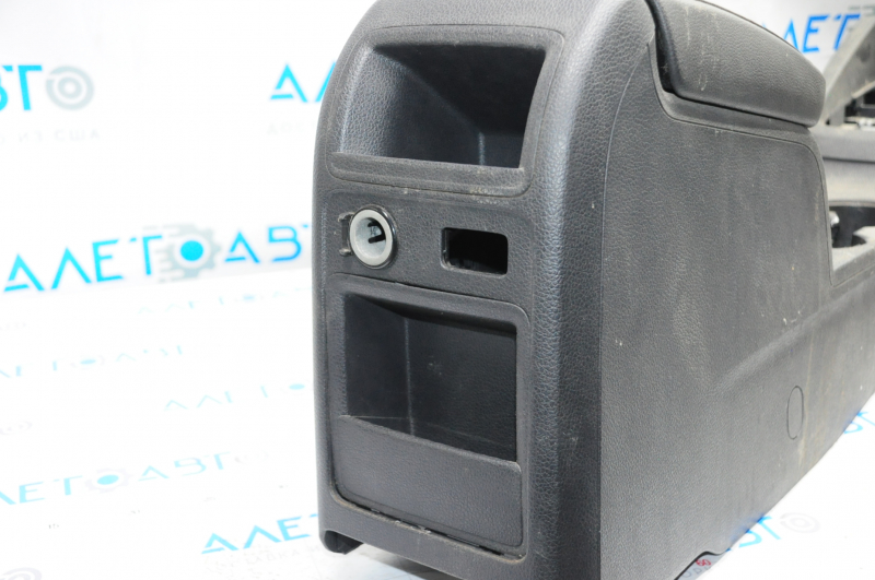 Central console armrest and cup holders VW Jetta 11-18 USA leather black, under armrest, under lock release button, under multimedia unit type 2, scratches