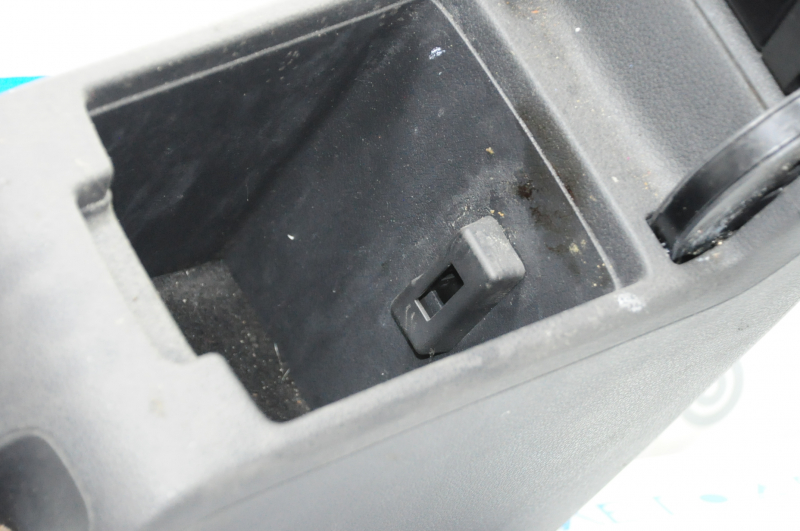 Central console armrest and cup holders VW Jetta 11-18 USA leather black, under armrest, under lock release button, under multimedia unit type 2, scratches