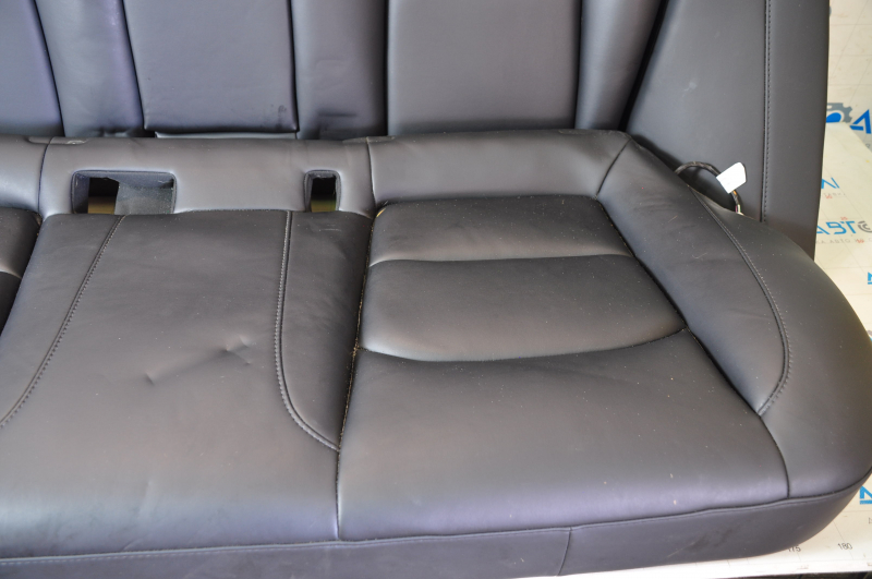 Rear seat row 2 Tesla Model 3 18- leather black, heated, water damage, dented