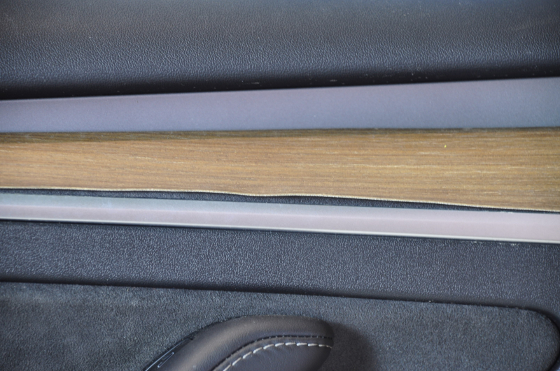 Door trim card front left Tesla Model 3 21 - black leather, wood, with window lift control and door opening button, wood swelled